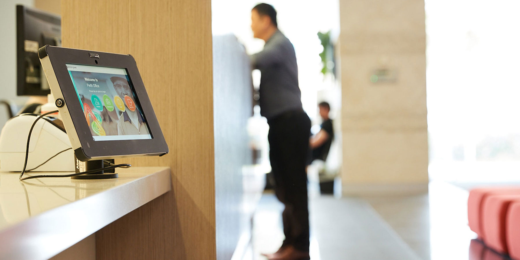 Western Power reception desk with a male stood at the counter